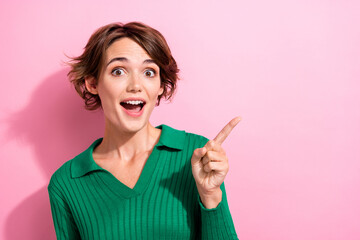 Portrait of overjoyed woman with short hair wear stylish shirt directing at empty space discount isolated on pink color background