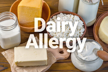 Food allergy, intolerance to dairy concept. Bottles with milk, cheese, sour cream, butter on a wooden background