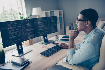 Side profile photo of young man job done professional system administrator thinking about his computer science project on office background
