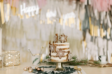 Festive cake on a gold plate with words happy new year background gift gold decorations