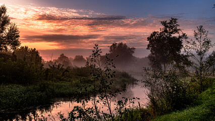 Morning fog at sunrise over the Suprasl River in Podlasie.