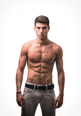 Fototapeta premium A shirtless handsome young man posing for a picture showing muscular torso, looking at camera, wearing grey jeans