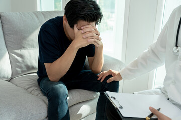 psychiatrist holds feel worried while discussing life and family issues. doctor encourages and...
