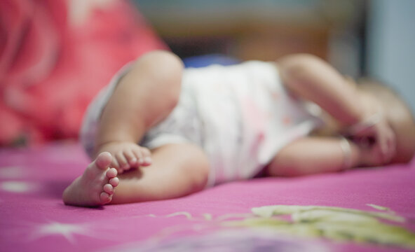 Newborn Feet, three month feet baby girl, close-up of a baby's foot, Foot of indian baby girl, newborn baby feet while sleeping on bed at home stock images.