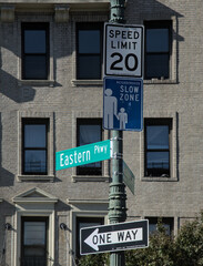 eastern parkway and washington avenue street sign in brooklyn (20 miles per hour speed limit mph)...