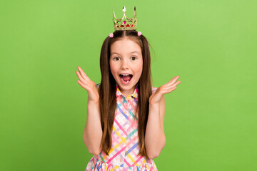 Photo of impressed adorable girl wear stylish costume wear golden crown raise hands rejoice cool...