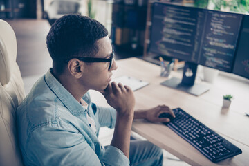 Photo of serious programmer young man working on outsource startup company researching and thinking...