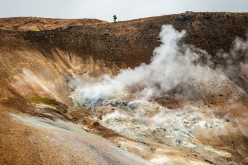 Adventurous hiker walking on a ridge in Iceland