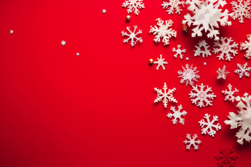 Fototapeta na wymiar Vibrant Red Background with Top View of Snowflakes with Copy Space.