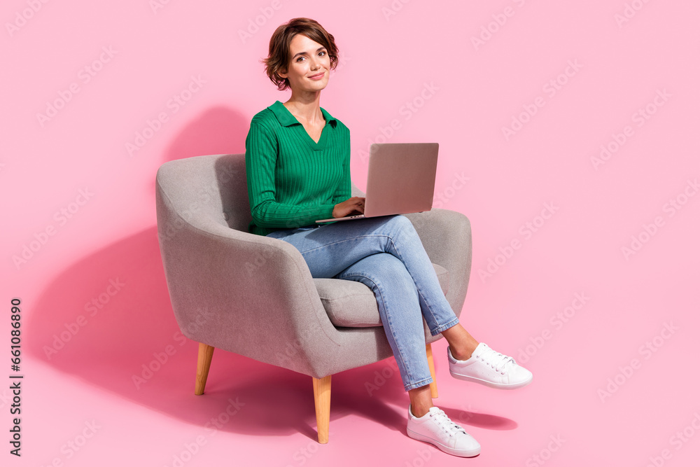 Poster Full length photo of young programmer girl using digital computer browsing internet and analyzing bugs isolated on pink color background