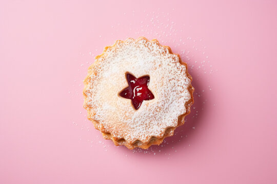 Single traditional Linzer Christmas cookie with shortcrust pastry and jam filling on pink background