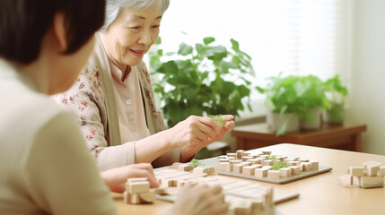 Obraz na płótnie Canvas Memory Games: An elderly person and a caregiver play memory games