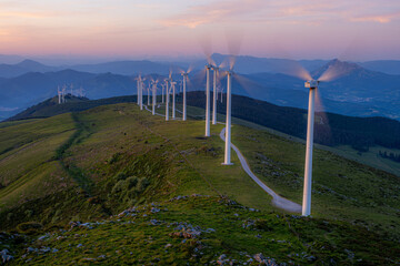Windmills on Oiz mountain at sunset