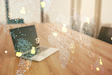 Double exposure of social network icons concept with world map and computer on background. Networking concept