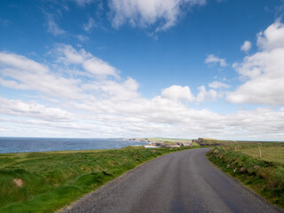 Small narrow ocean by the ocean. Ireland, Kilkee area. Warm sunny day, blue cloudy sky. Travel, tourism and sightseeing concept. Irish landscape and coastline.