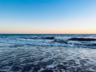 Quiet orange sea horizon, evening seascape background