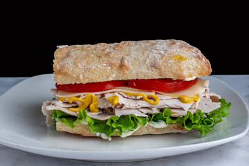 turkey with cheese tomato on a ciabatta
