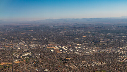 Panoramic view of Phoenix, Arizona  and the mountain area from an airplane window.
