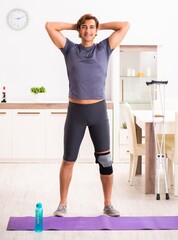 Fototapeta na wymiar Man exercising for knee injury recovery