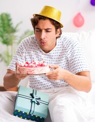 Young man celebrating his birthday in hospital