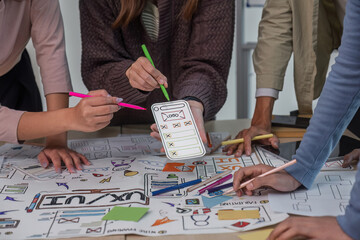 Close up ux developer and ui designer brainstorming interface wireframe design.Creative digital...