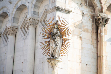 Statue over cathedral in Lucca