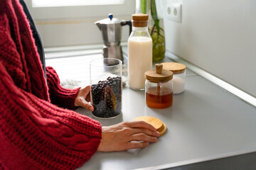 Unrecognizable hands of a person preparing breakfast in a kitchen