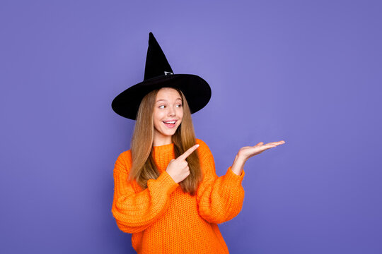 Photo of girl interested looking pointing finger novelty on her arm second ticket for halloween free isolated over purple color background