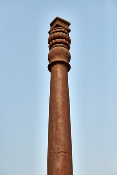 Iron pillar of Delhi structure part Qutb complex in South Delhi, India, rust resistant iron pillar landmark popular touristic spot in New Delhi, ancient structure with high resistance to corrosion
