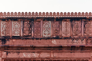 Ancient wall decoration of Agra Red Fort, beautiful decorative patterns on Red Fort wall depicting abstract patterns, old cracked ornament decoration in Agra Red Fort landmark building