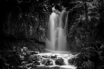 Long exposure in black and white of a waterfall in a forest
