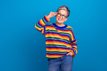 Fototapeta premium Photo of intelligent minded lady arm touch glasses look interested empty space isolated on blue color background