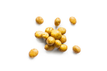 Closeup of a pile of fresh organic potatoes from the garden isolated on a white background from above, top view - obrazy, fototapety, plakaty