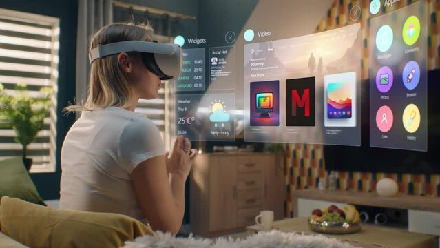 Woman in VR headset chooses movie or TV show to watch at home. 3D futuristic hologram shows interface of streaming service application and widgets in user menu. VFX animation. Concept of lifestyle.