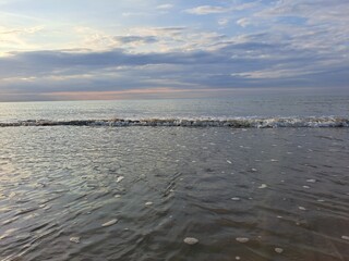 Obraz premium The French coast in summer, the coast with sunrise and sea waves.