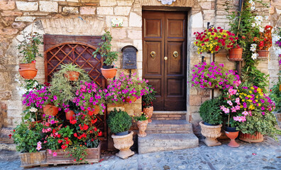 Fototapeta na wymiar Traditional old villages of Italy, Umbria - beautiful Spello town. Charming floral streets decoration