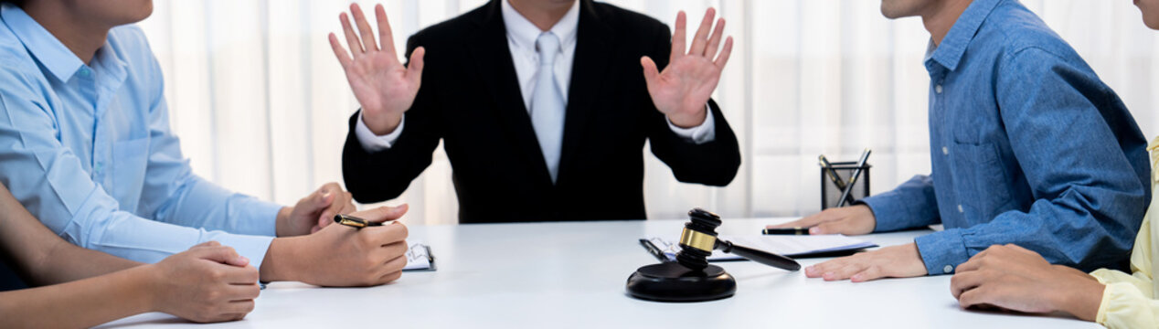 Lawyer acting as mediator broke a compromise between two parties to resolve business dispute through negotiation at law firm office. Legal mediation and conflict resolution service. Panorama Rigid