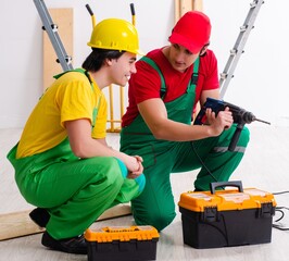 Two workers contractors working indoors