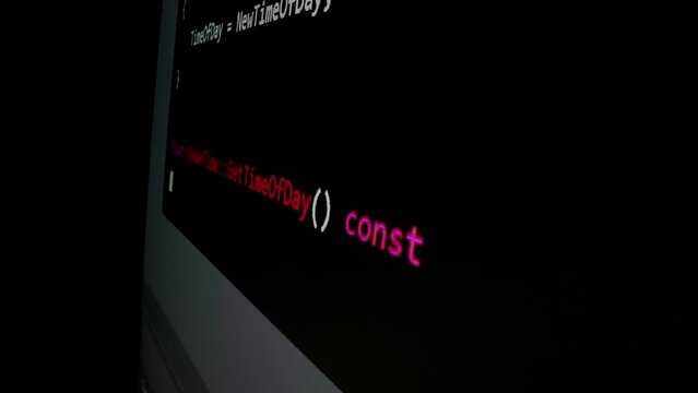 Closeup macro shot movement of coding script moving across LED screen with real-time AI-generated typing, showcasing advanced AI learning in optimization, debug and coding for software development.