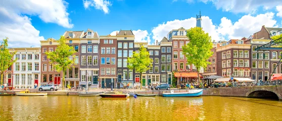 Zelfklevend Fotobehang Panorama of Amsterdam city, scenic skyline over Amstel canal, Netherlands © Arcady