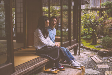 Young japanese couple spending time in their house