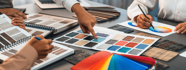 Group of professional interior designer and architect working together, planning and choosing color...