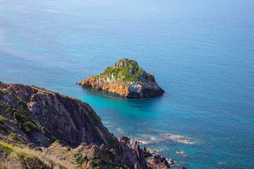 small rocky islet just off Sardinia, Italy