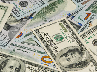Background from paper dollars in denominations of 100 dollars.