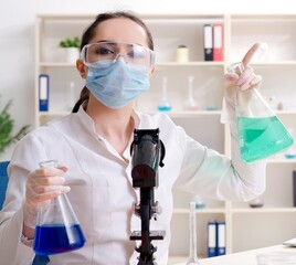 Young female chemist working in the lab
