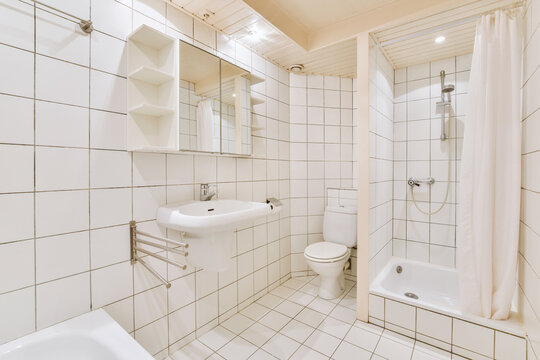Bathroom with shower cabin and toilet bowl