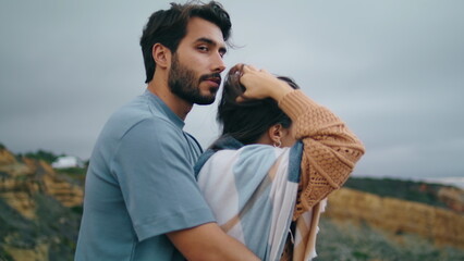 Tender couple posing nature standing in front gloomy cloudy sky together closeup