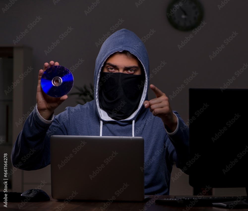 Poster male hacker hacking security firewall late in office