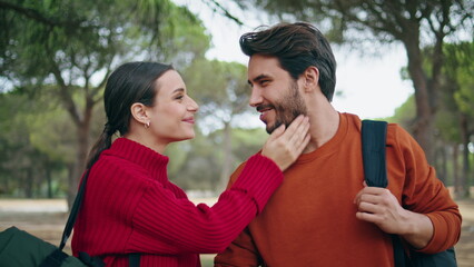 Fototapeta premium Tourists love kissing walking at beautiful forest close up. Couple enjoy stroll.