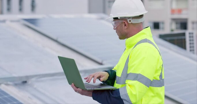 Engineering, man and laptop for solar panels, energy saving and power research or sustainable electricity on rooftop. Technician or worker typing on computer, planning installation or upgrade in city